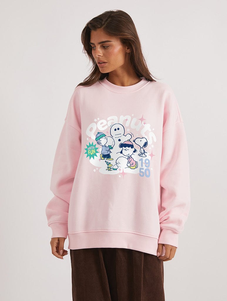 Peanuts x Skinnydip Snoopy Snowman Sweatshirt in Pink Hoodies & Sweatshirts Skinnydip London