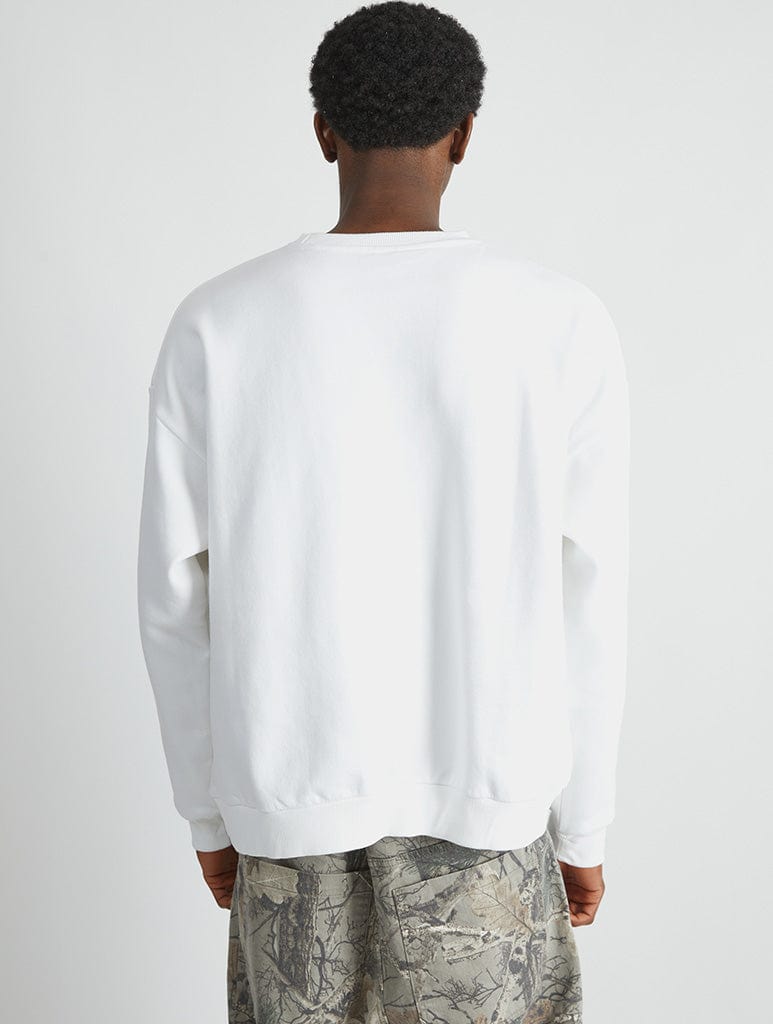 The Simpsons Smiley Egg Still Sweatshirt in White Hoodies & Sweatshirts Skinnydip London