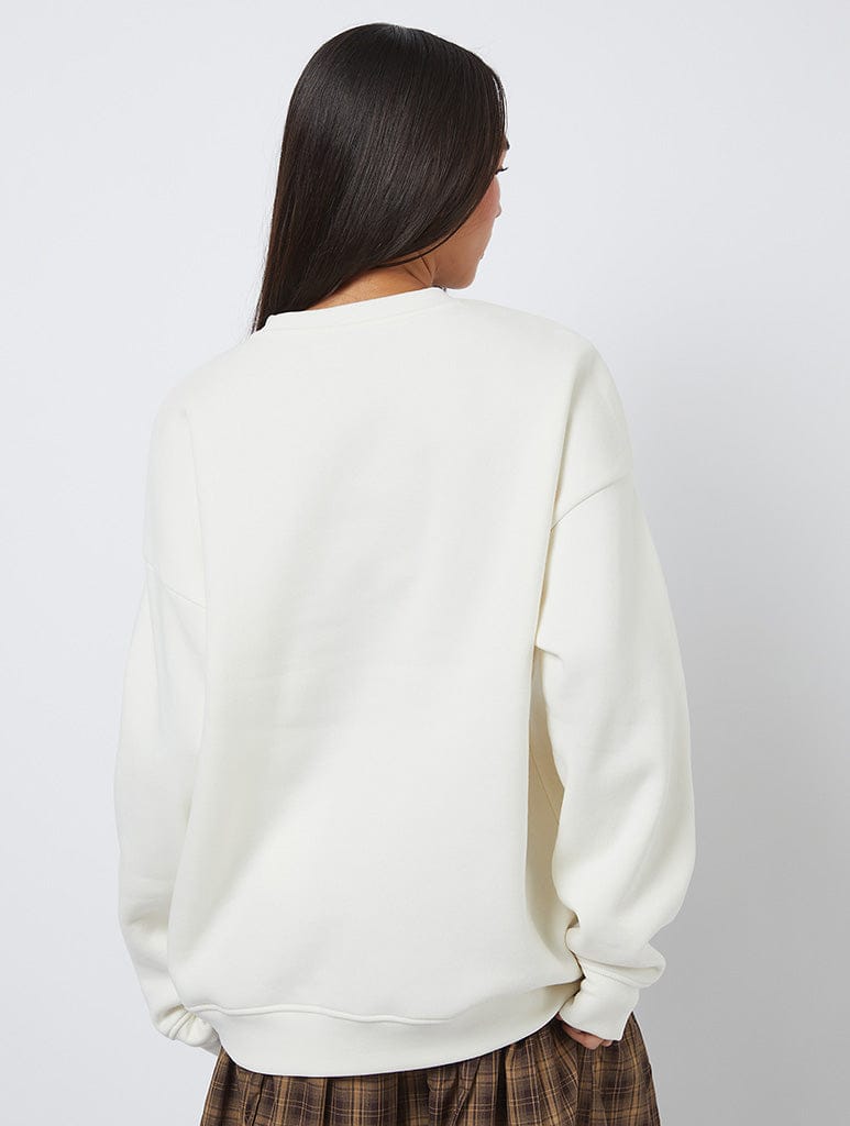 Busy Living The Slow Life Sweatshirt In White Hoodies & Sweatshirts Skinnydip London