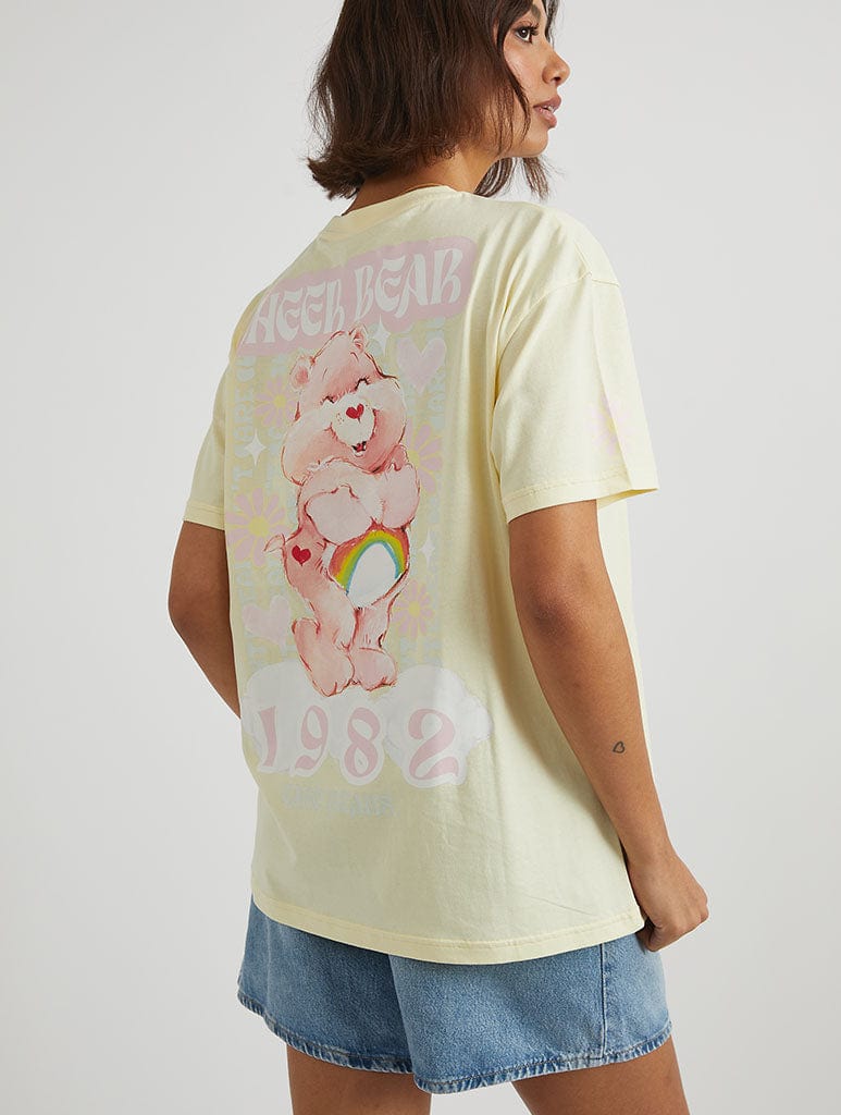 Care Bears x Skinnydip Cheer Bear T-Shirt in Yellow Tops & T-Shirts Skinnydip London
