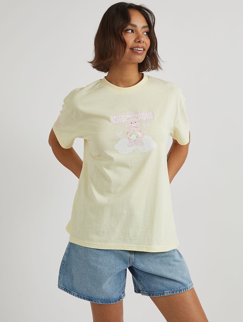 Care Bears x Skinnydip Cheer Bear T-Shirt in Yellow Tops & T-Shirts Skinnydip London