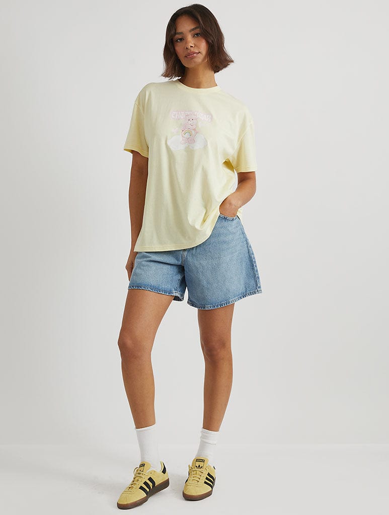 Care Bears x Skinnydip Cheer Bear T-Shirt in Yellow Tops & T-Shirts Skinnydip London