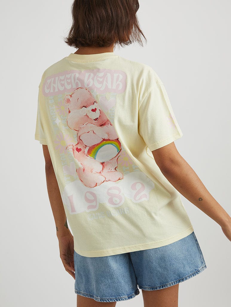 Care Bears x Skinnydip Cheer Bear T-Shirt in Yellow Tops & T-Shirts Skinnydip London