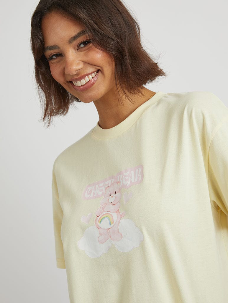 Care Bears x Skinnydip Cheer Bear T-Shirt in Yellow Tops & T-Shirts Skinnydip London