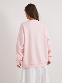 Care Bears x Skinnydip Funshine Bear Easter Egg Sweatshirt In Pink Hoodies & Sweatshirts Skinnydip London