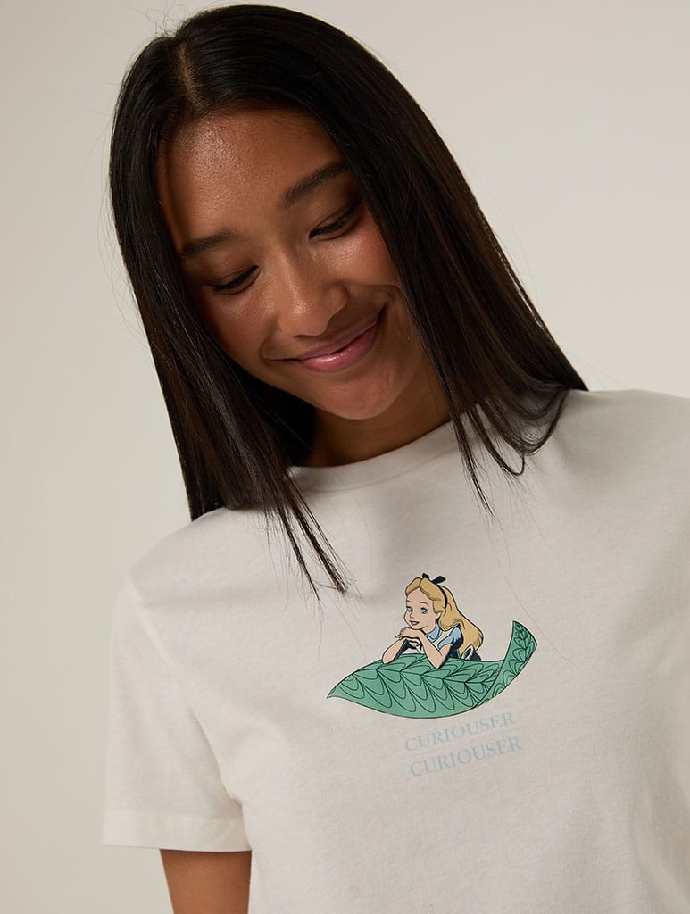Disney Alice In Wonderland Curiouser and Curiouser Baby T-Shirt In White Tops & T-Shirts Skinnydip London