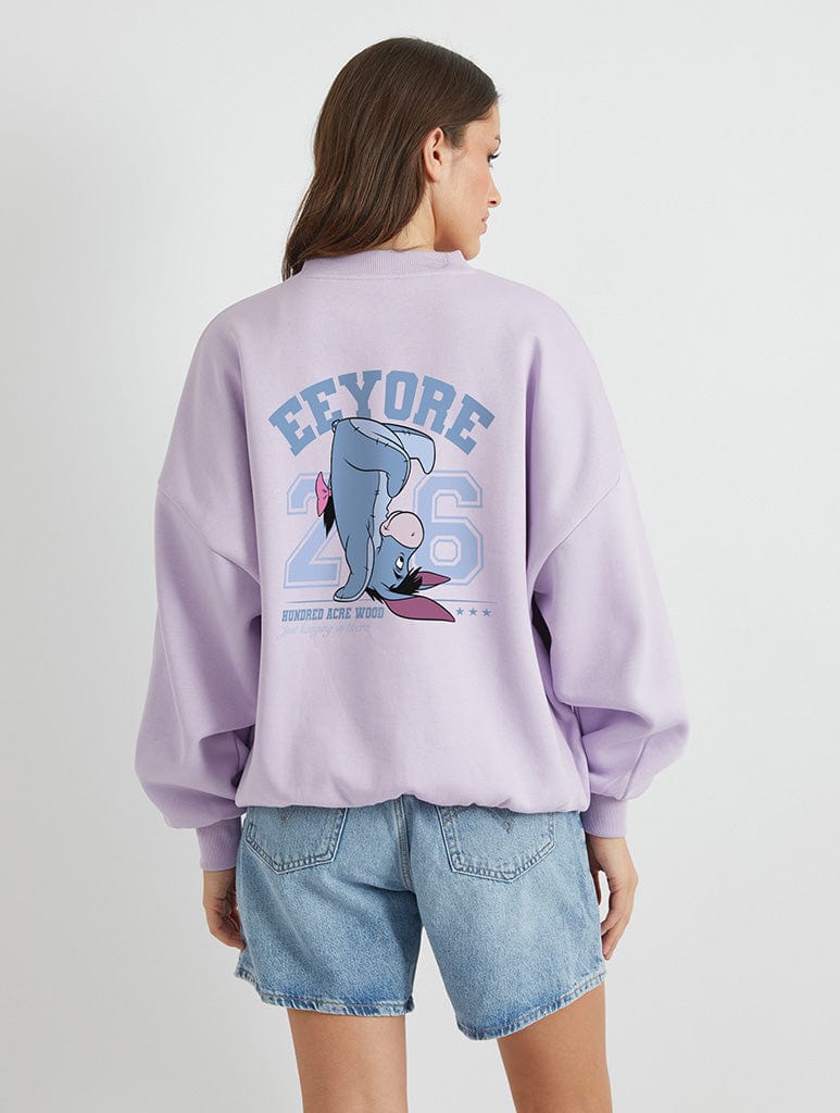 Disney Eeyore Varsity Sweatshirt In Lilac Hoodies & Sweatshirts Skinnydip London