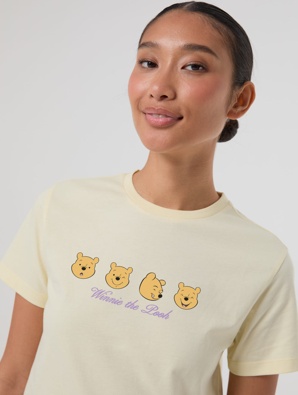 Disney Winnie The Pooh Faces Baby T-Shirt In Butter Yellow Tops & T-Shirts Skinnydip London