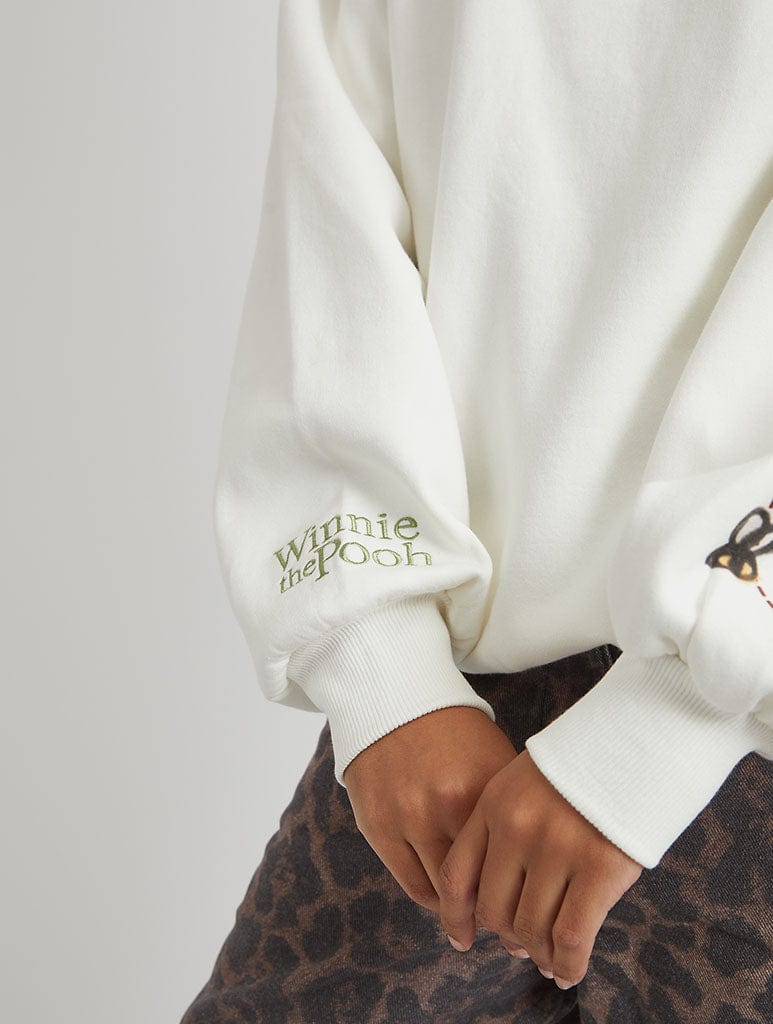 Disney Winnie The Pooh Strawberry Sweatshirt in Ecru Hoodies & Sweatshirts Skinnydip London