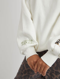 Disney Winnie The Pooh Strawberry Sweatshirt in Ecru Hoodies & Sweatshirts Skinnydip London