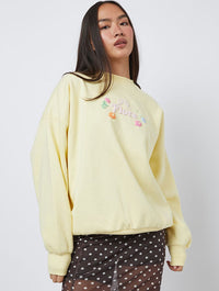 Flora Sweatshirt in Yellow Hoodies & Sweatshirts Skinnydip London