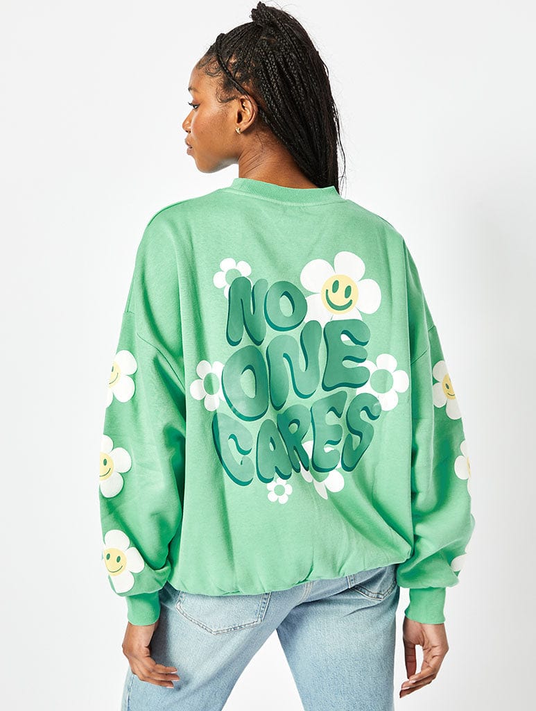 No One Cares Oversized Sweatshirt in Washed Green | Slogan Tops | Skinnydip  London