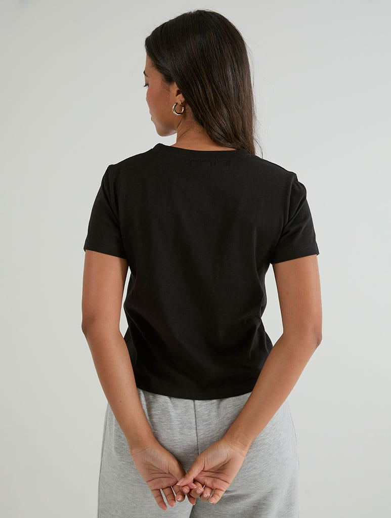 Tactically Delusional Baby T-Shirt In Black Tops & T-Shirts Skinnydip London