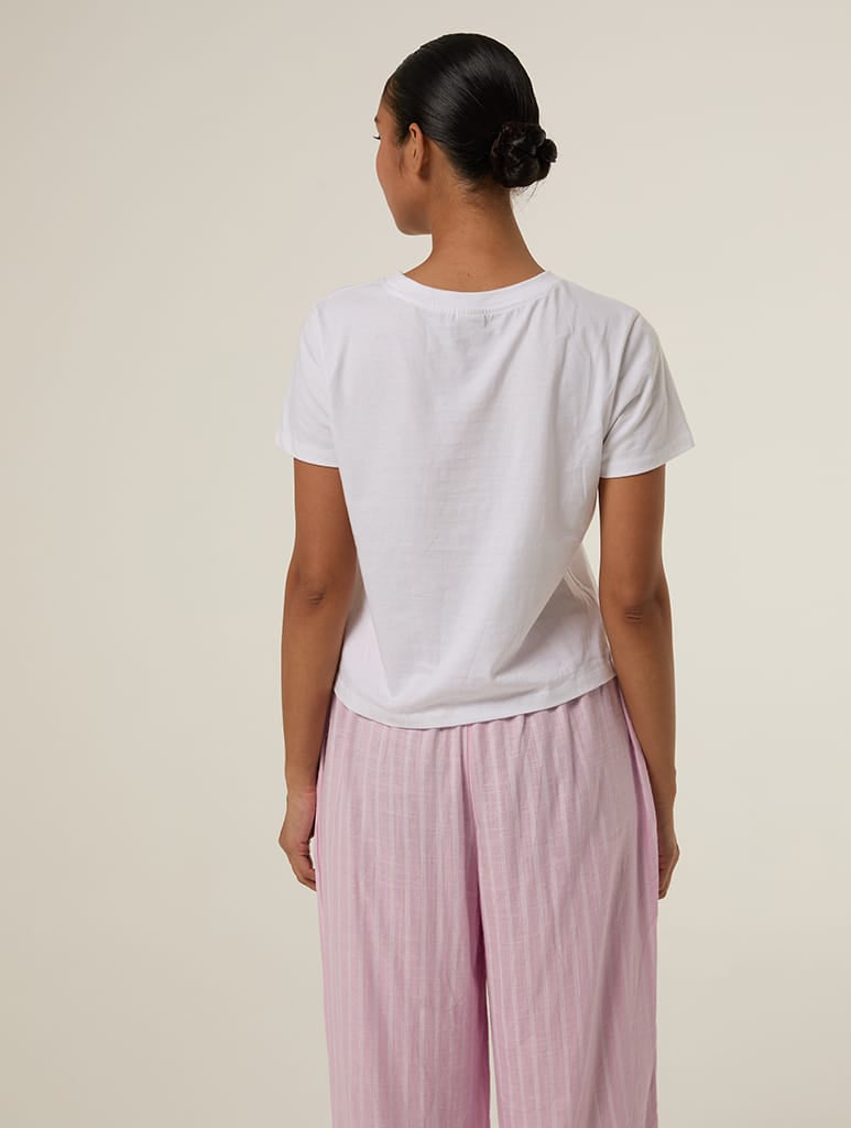 The Romantic Tour Ticket Baby T-Shirt In White Tops & T-Shirts Skinnydip London
