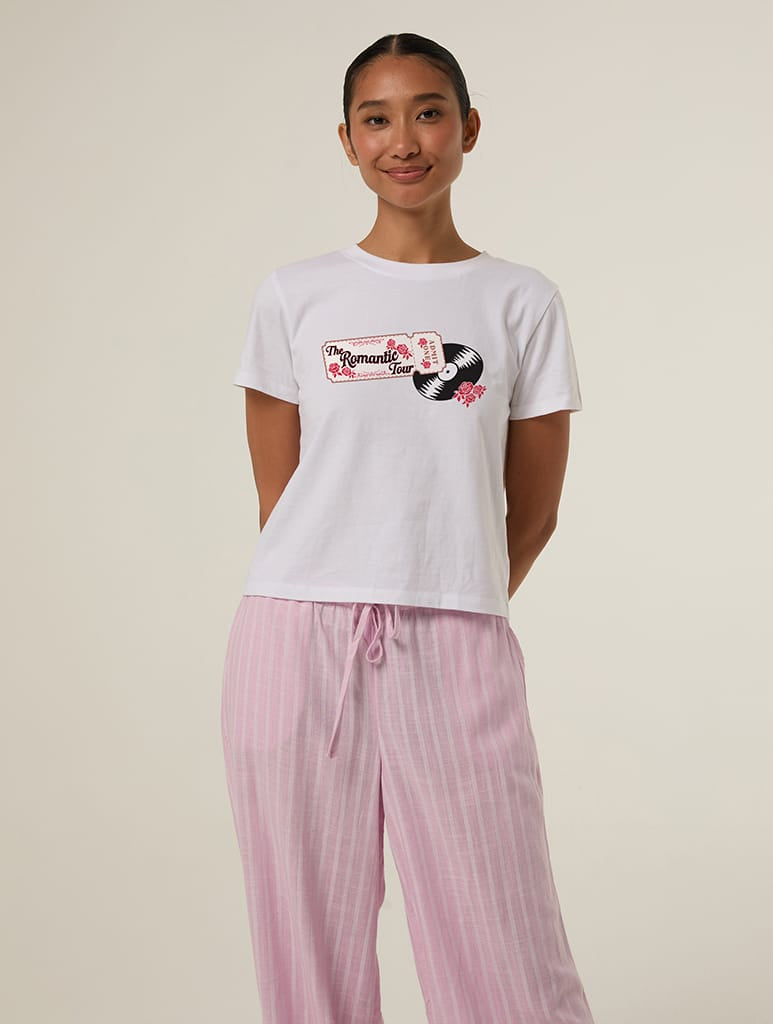 The Romantic Tour Ticket Baby T-Shirt In White Tops & T-Shirts Skinnydip London